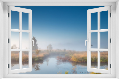 Fototapeta Naklejka Na Ścianę Okno 3D - morning sunshine over misty swamp