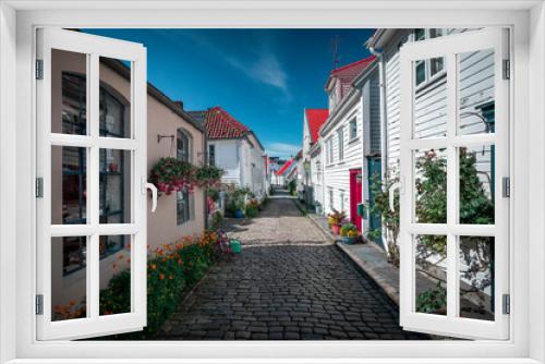 Fototapeta Naklejka Na Ścianę Okno 3D - Old town Gamle Stavanger with white timber houses in Norway, during sunshine and blue sky