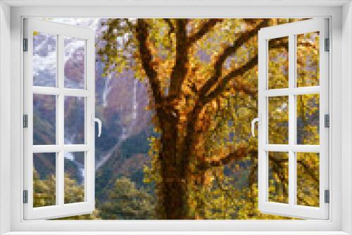 Fototapeta Naklejka Na Ścianę Okno 3D - This image shows the stunning scenery of the Himalayan mountains in Nepal during autumn. The golden hues of the foliage contrast with the snow-capped peaks