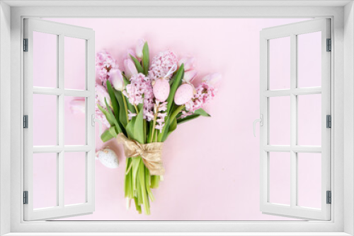 Fototapeta Naklejka Na Ścianę Okno 3D - Easter scene with fresh tulips and hyacinth flowers over pink background, scene with easter colored eggs