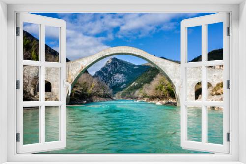 Fototapeta Naklejka Na Ścianę Okno 3D - The great arched stone bridge of Plaka on Arachthos river, Tzoumerka, Greece.