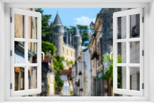 Fototapeta Naklejka Na Ścianę Okno 3D - Street in the Beautiful Village of Montresor, with the Facade of Montresor Castle, Loire, France