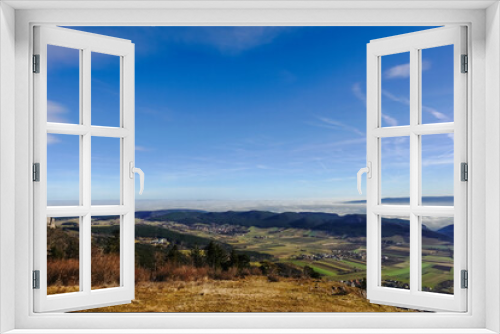 view to dense fog at the horizon with blue sky and sunshine