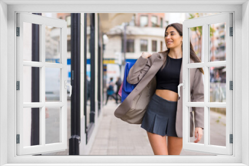 Woman shopping with bags in the city, concept sales, consumerism, copy paste, black friday