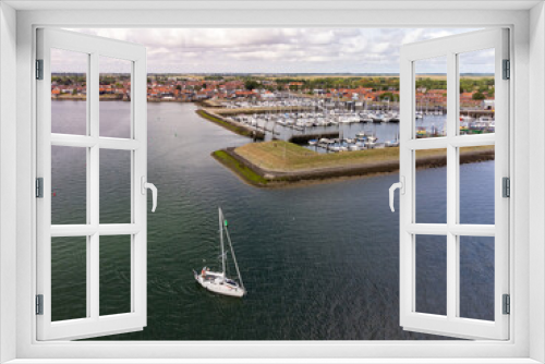 Fototapeta Naklejka Na Ścianę Okno 3D - A drone view of a marina and historic town of Yerseke, The Netherlands