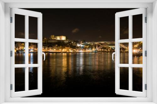 Fototapeta Naklejka Na Ścianę Okno 3D - Night scene, Porto Portugal, with reflections in the river Douro.