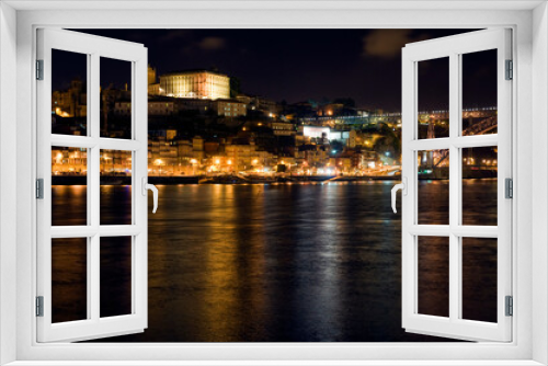 Fototapeta Naklejka Na Ścianę Okno 3D - Night scene, Porto Portugal, with reflections in the river Douro.