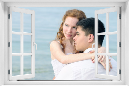 beautiful young couple in love near the sea