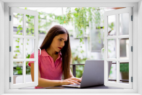 Transgender woman working with her laptop, social integration concept