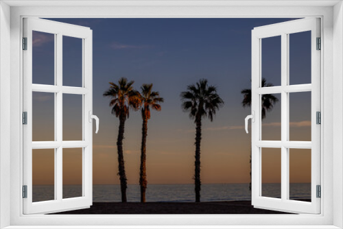 Fototapeta Naklejka Na Ścianę Okno 3D -  seaside landscape peace and quiet sunset and four palm trees on the beach