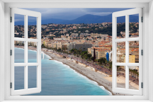 Fototapeta Naklejka Na Ścianę Okno 3D - Sandy Beach by Historic City of Nice, France. View from Castle Hill. Cloudy Evening before Sunset.