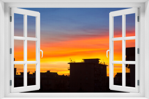 Fototapeta Naklejka Na Ścianę Okno 3D - city skyline at sunset with vivid colors