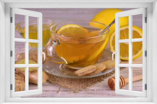 Fototapeta Naklejka Na Ścianę Okno 3D - Ginger tea with lemon and honey in a transparent cup.
