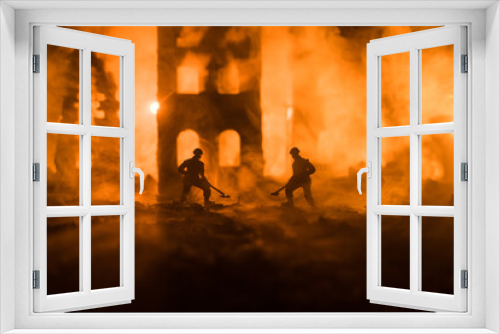 Fototapeta Naklejka Na Ścianę Okno 3D - War Concept. Military silhouettes fighting scene on war fog sky background. Sappers clears mines at the site of recent fighting zone. Battle in ruined city.