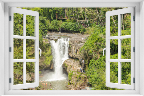 Fototapeta Naklejka Na Ścianę Okno 3D - Tegenungan waterfall, Bali, Indonesia. Jungle, forest, daytime with cloudy sky.