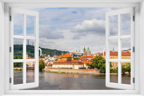 Fototapeta Naklejka Na Ścianę Okno 3D - waterfront view across the river Vltava to Castle, Charles Bridge and Petrin Lookout tower, Prague, Czech republic