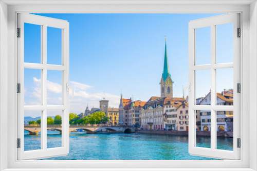 Fototapeta Naklejka Na Ścianę Okno 3D - Scenic panoramic view of historic Zürich city center with famous Fraumünster and Grossmünster Church and river Limmat at Lake Zurich on a beautiful sunny day with blue sky in summer, Switzerland