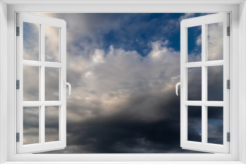 Unusual dark gray layered stratus clouds, skyscape.