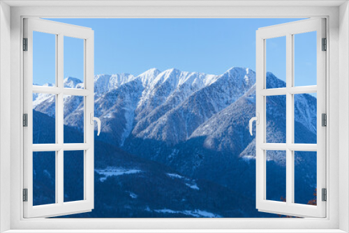 Fototapeta Naklejka Na Ścianę Okno 3D - The Valtellina mountains, with its pastures, woods and fresh snow, during a wonderful winter day near the village of Sondrio, Italy - January 2023.