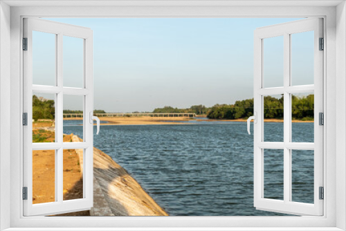 Fototapeta Naklejka Na Ścianę Okno 3D - The Cauvery river flowing through a dam in the village of Thiruvaiyaru near Kumbakonam in Tamil Nadu.