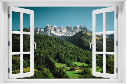 Fototapeta Naklejka Na Ścianę Okno 3D - Majestic mountains in the Alps covered with trees and clouds