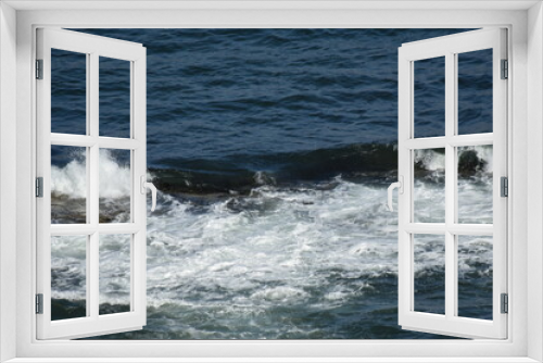 Fototapeta Naklejka Na Ścianę Okno 3D - Aerial view looking down onto waves crashing onto rocks. North Berwick Scotland. 