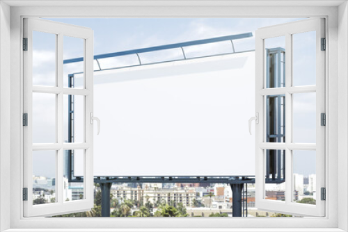 Fototapeta Naklejka Na Ścianę Okno 3D - Blank white horizontal billboard on city buildings background at daytime, perspective view. Mockup, advertising concept