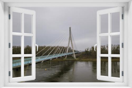 Fototapeta Naklejka Na Ścianę Okno 3D - Eine lange große moderne Brücke über einen Fluss aus der Luft