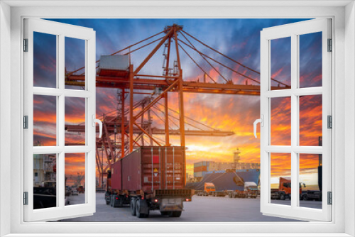 Fototapeta Naklejka Na Ścianę Okno 3D - Crane loading cargo container freight container ship in the international terminal logistics sea port concept freight shipping by ship, Truck running in port under the Big Crane transport.