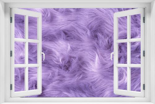 Purple fur texture top view. Purple or lilac sheepskin background. Fur pattern. Texture of lilac shaggy fur. Wool texture. Sheep fur close up