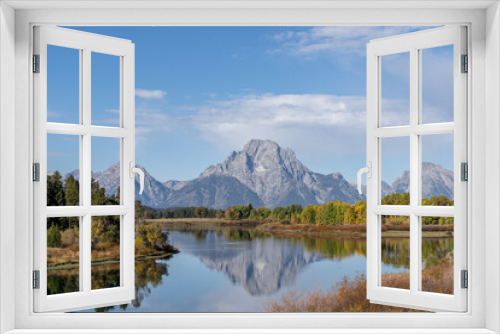 Fototapeta Naklejka Na Ścianę Okno 3D - Mt. Moran and the Grand Tetons reflected in still water of the Snake River at Oxbow Bend in Autumn

