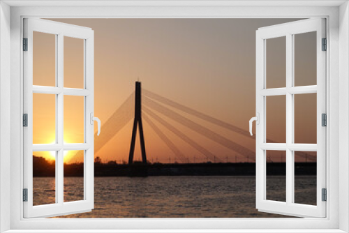 Fototapeta Naklejka Na Ścianę Okno 3D - The silhouette of Vansu Bridge in Riga at sunset