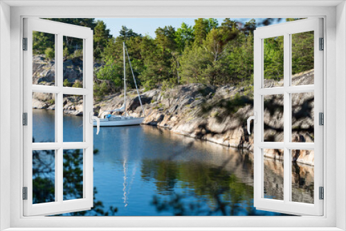 Fototapeta Naklejka Na Ścianę Okno 3D - Sailboat anchored near remote rocky island in Stockholm archipelago, Sweden