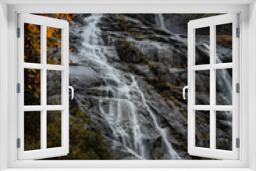 Fototapeta Naklejka Na Ścianę Okno 3D - The Nardis Waterfall in Trentino Alto Adige during a foggy and rainy day in autumn, Northern Italy