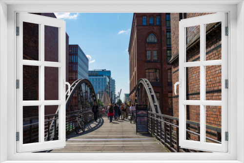 Fototapeta Naklejka Na Ścianę Okno 3D - Hamburg, Germany - August 1, 2021: Famous Speicherstadt watehouse district. Bridges of Hamburg city. Hafen City quarter. High quality photo