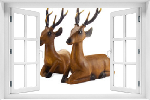 Fototapeta Naklejka Na Ścianę Okno 3D - Deer carved wood isolated on white background.