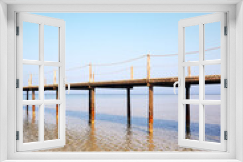 Fototapeta Naklejka Na Ścianę Okno 3D - Wooden sea pier, summer vacation concept, color toning applied.