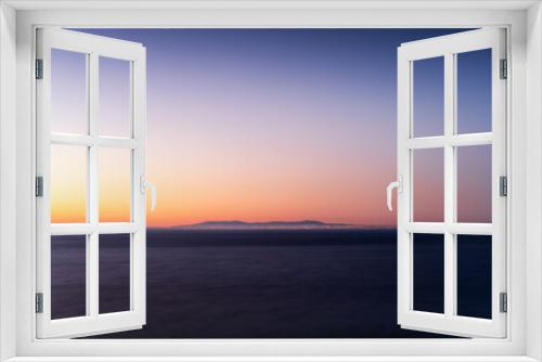 Fototapeta Naklejka Na Ścianę Okno 3D - Colourful twilight over the ocean, long-exposure with Atlantic Ocean on foreground and Lisbon, Cascais and Sintra on background, Colour Photo, Cabo Espichel, Sesimbra, Portugal
