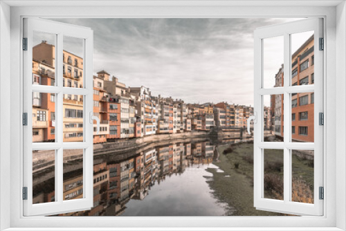 Fototapeta Naklejka Na Ścianę Okno 3D - Views of the riera de Girona in Spain from the bridge