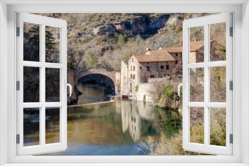 Fototapeta Naklejka Na Ścianę Okno 3D - Vue sur le moulin de Corp à Saint André de Vézines dans le département de l'Aveyron en région Occitanie