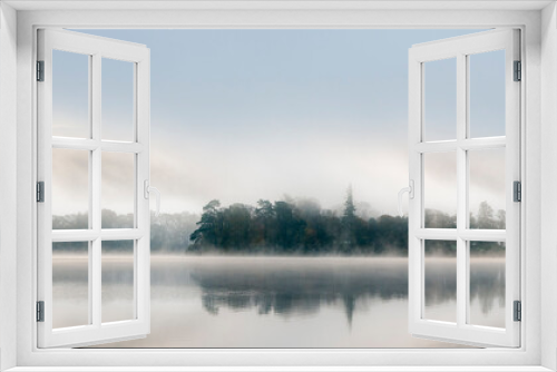 Fototapeta Naklejka Na Ścianę Okno 3D - Very misty dawn over still lake Derwentwater