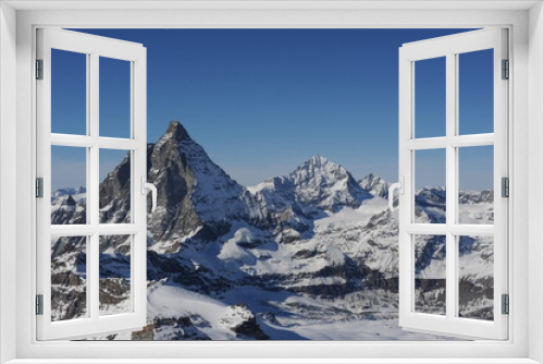 Fototapeta Naklejka Na Ścianę Okno 3D - Matterhorn mountain peak  in Alps in winter with snow and clear blue sky in Cervinia, Italy and Zermatt, Switzerland. Beautiful and magnificent landscape on a sunny day