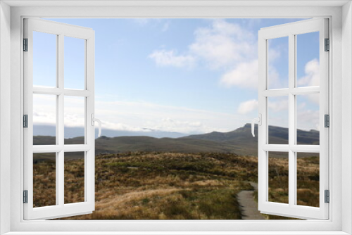 Fototapeta Naklejka Na Ścianę Okno 3D - The Old Man of Storr is a famous rock pinnacle on the Isle of Skye, Scotland. A popular hiking spot, it towers at 50 meters high and offers breathtaking panoramic views.