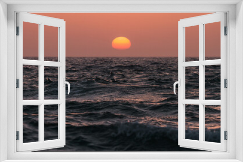 Fototapeta Naklejka Na Ścianę Okno 3D - Orange sunset over the sea water surface