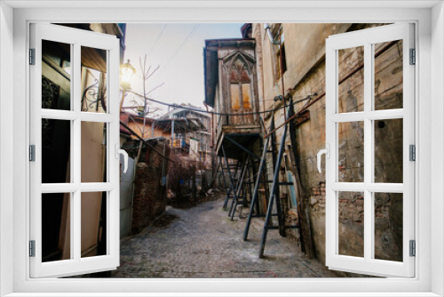Fototapeta Naklejka Na Ścianę Okno 3D - Old shabby houses in the slum district of Tbilisi