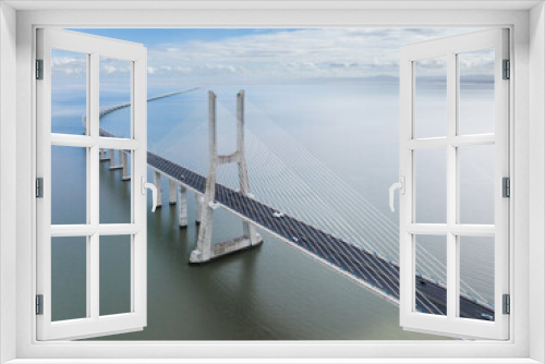 Fototapeta Naklejka Na Ścianę Okno 3D - Vasco Da Gama Bridge in Lisbon, Portugal over the Tagus River. Drone Point of View