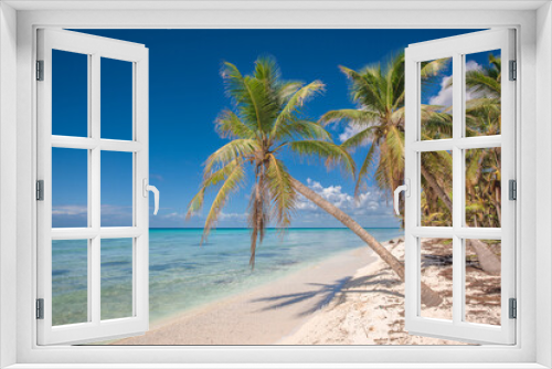 Fototapeta Naklejka Na Ścianę Okno 3D - Tropical paradise beach with white sand and coconut palms. clear blue water on Saona Island in Dominican Republic. travel tourism wide panorama background concept