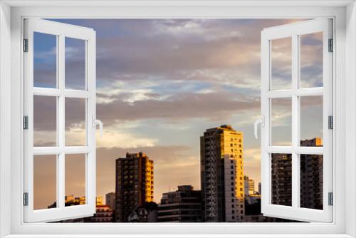 Fototapeta Naklejka Na Ścianę Okno 3D - City at sunset