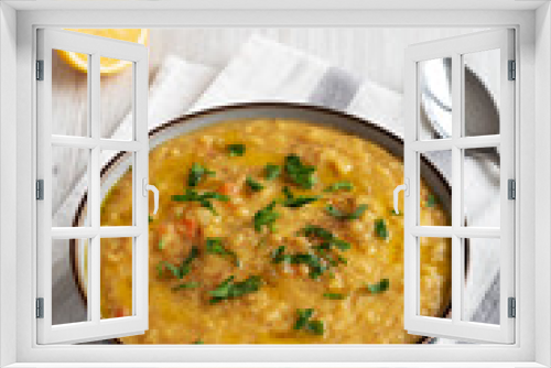 Fototapeta Naklejka Na Ścianę Okno 3D - Homemade Lentil Soup with Parsley in a Bowl on a white wooden background, side view.