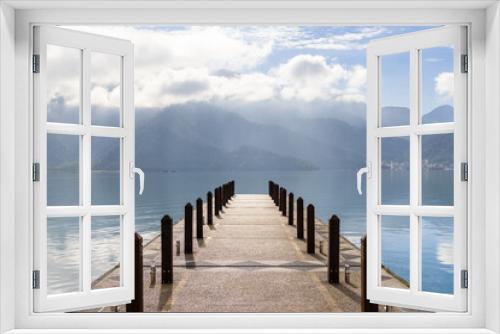 Fototapeta Naklejka Na Ścianę Okno 3D - Large blue lake surrounded by mountains with pier in the morning at sun moon lake of Taiwan